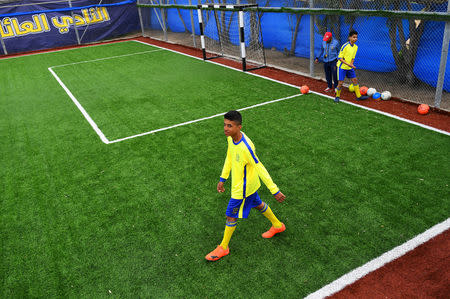 Moatasem Al-Nabeeh, 14, who is diagnosed with cancer, plays soccer with fellow cancer patients in Gaza City, February 15, 2019. REUTERS/Dylan Martinez