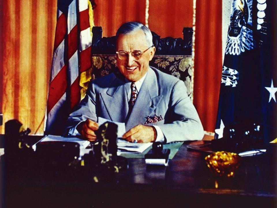 President Truman signs the Foreign Aid Assistance Act in 1947 (Getty)