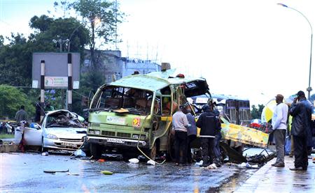 Damaged vehicles are seen at the scene of a blast near Pangani Police Station in Kenya's capital Nairobi, December 14, 2013. REUTERS/Noor Khamis