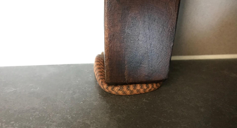 The tiny snake was curled up around a leg of the right stool. Source: Supplied