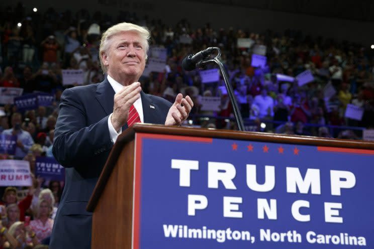 Donald Trump applauds during a campaign rally in Wilmington, N.C. (Photo: Evan Vucci/AP)