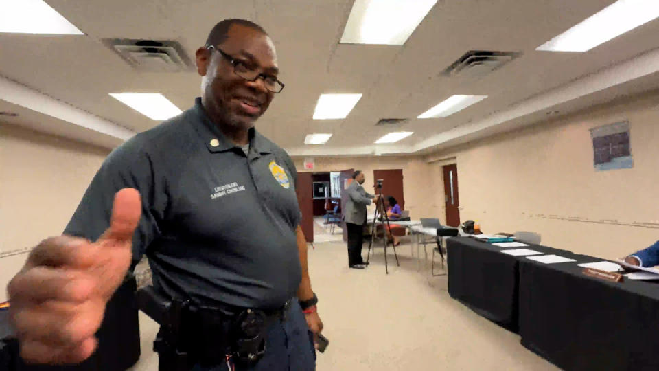 <em>Bennettsville Police Department Acting Assistant Chief Sammy Crosland tried to end Chief Investigative Reporter Jody Barr’s questioning of city officials during an April 16, 2024, city council meeting that had not yet started. (WJZY Photo/Jody Barr)</em>