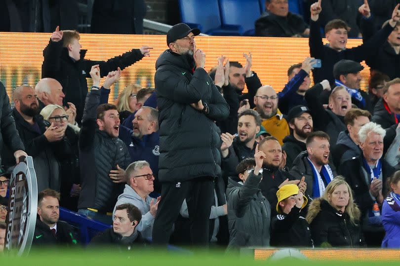 Jurgen Klopp puts his finger to his lips in an attempt to silence <a class="link " href="https://sports.yahoo.com/soccer/teams/everton/" data-i13n="sec:content-canvas;subsec:anchor_text;elm:context_link" data-ylk="slk:Everton;sec:content-canvas;subsec:anchor_text;elm:context_link;itc:0">Everton</a> supporters during the Premier League match between Everton FC and <a class="link " href="https://sports.yahoo.com/soccer/teams/liverpool/" data-i13n="sec:content-canvas;subsec:anchor_text;elm:context_link" data-ylk="slk:Liverpool FC;sec:content-canvas;subsec:anchor_text;elm:context_link;itc:0">Liverpool FC</a> at Goodison Park on April 24, 2024 -Credit:Photo by James Gill - Danehouse/Getty Images