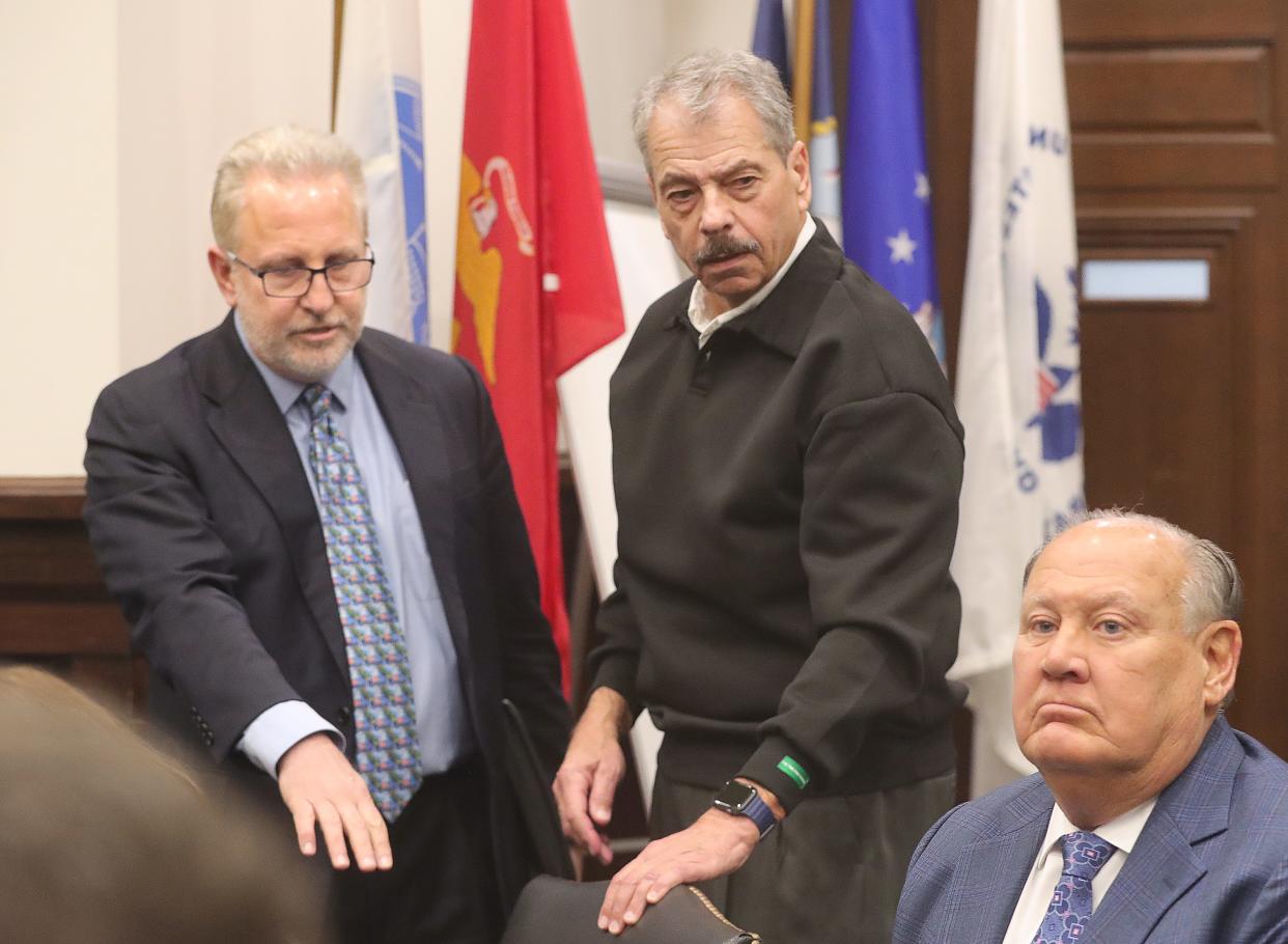 Defense attorney Richard Blake, left, and his clients, former Public Utilities Chairman Sam Randazzo and former FirstEnergy CEO Charles "Chuck" Jones, arrive in Summit County Court to be arraigned by Judge Susan Baker Ross. The men pleaded not guilty.