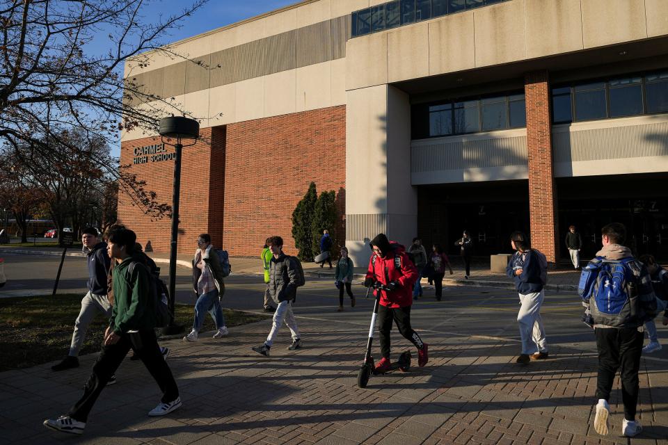 Students leave upon dismissal from Carmel High School on Tuesday, Nov. 28, 2023, in Carmel, Ind.