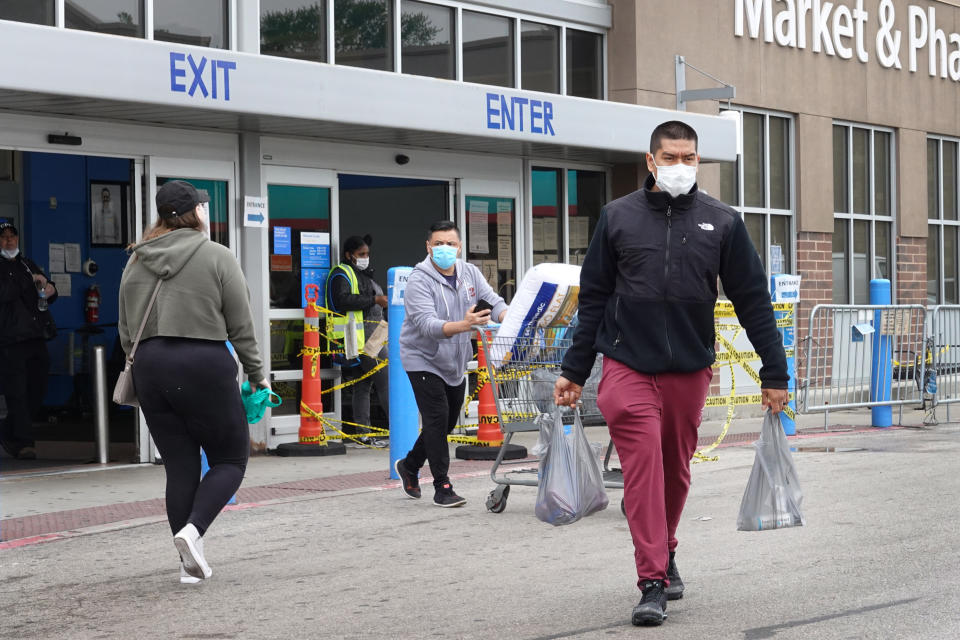 CHICAGO, ILLINOIS - MAY 19: Customers shop at a Walmart store on May 19, 2020 in Chicago, Illinois. Walmart reported a 74% increase in U.S. online sales for the quarter that ended April 30, and a 10% increase in same store sales for the same period as the effects of the coronavirus helped to boost sales. (Photo by Scott Olson/Getty Images)