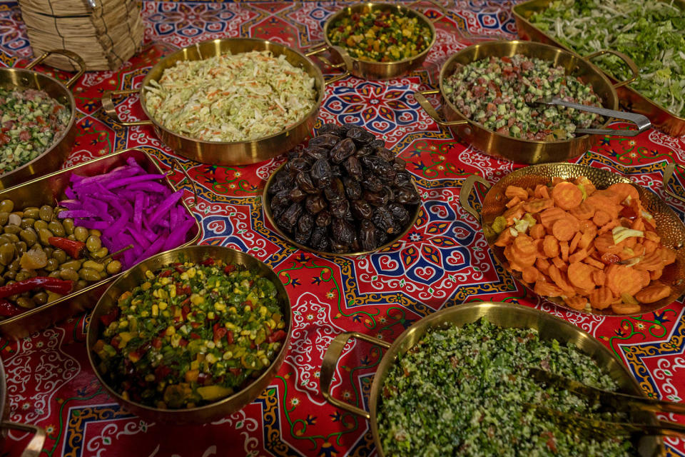 A detail shot of the table with dishes around a plate of dates. (Avishag Shaar-Yashuv for NBC News)