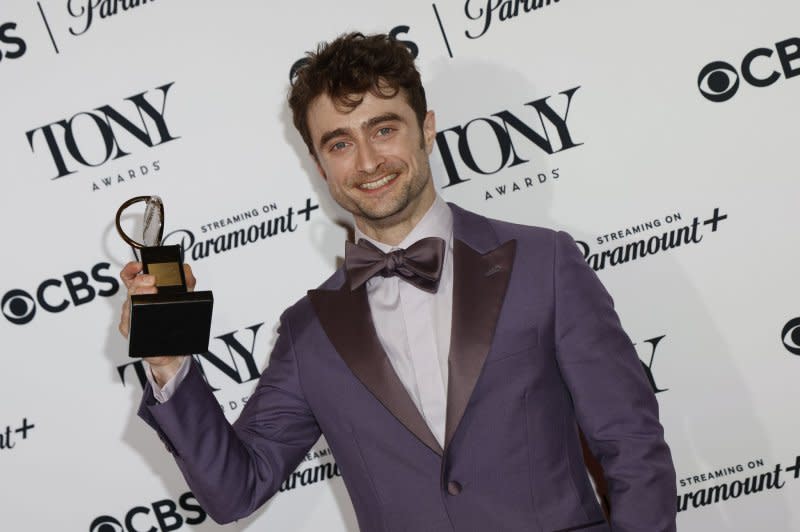 Daniel Radcliffe, recipient of the Best Performance by an Actor in a Featured Role in a Musical award for "Merrily We Roll Along", holds his Tony Award in the press room at the David H. Koch Theater at Lincoln Center for the Performing Arts on Sunday in New York City. Photo by Peter Foley/UPI