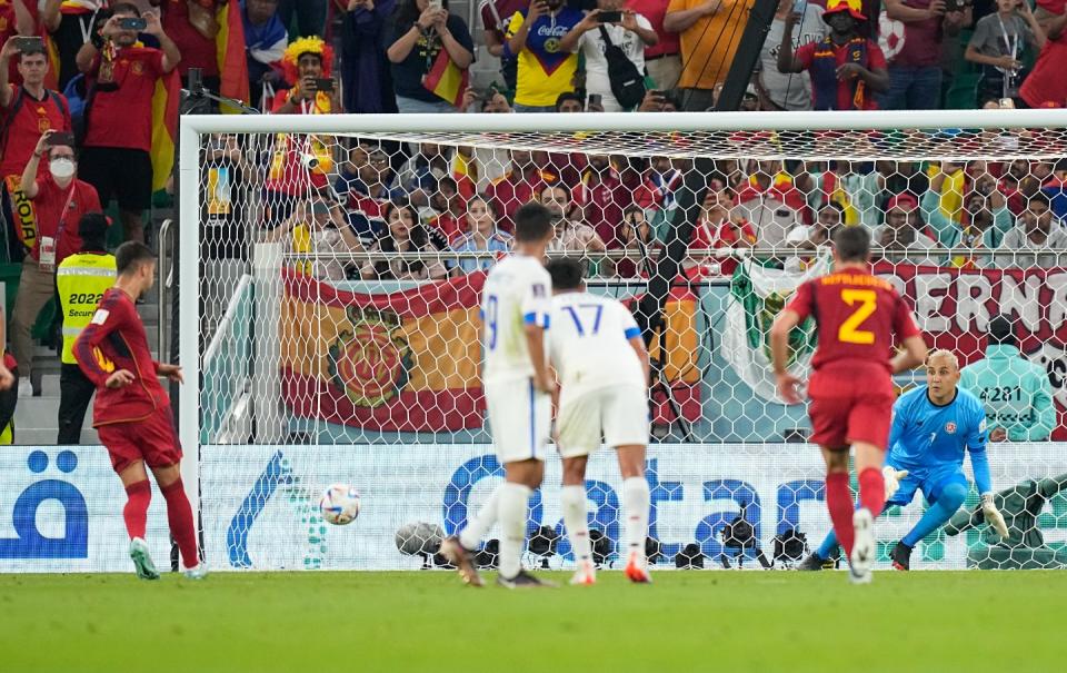 Spain's Ferran Torres, left, scores his side's third goal from penalty spot during the World Cup group E football match between Spain and Costa Rica, at the Al Thumama Stadium in Doha, Qatar, Wednesday, Nov. 23, 2022. (AP Photo/Pavel Golovkin)