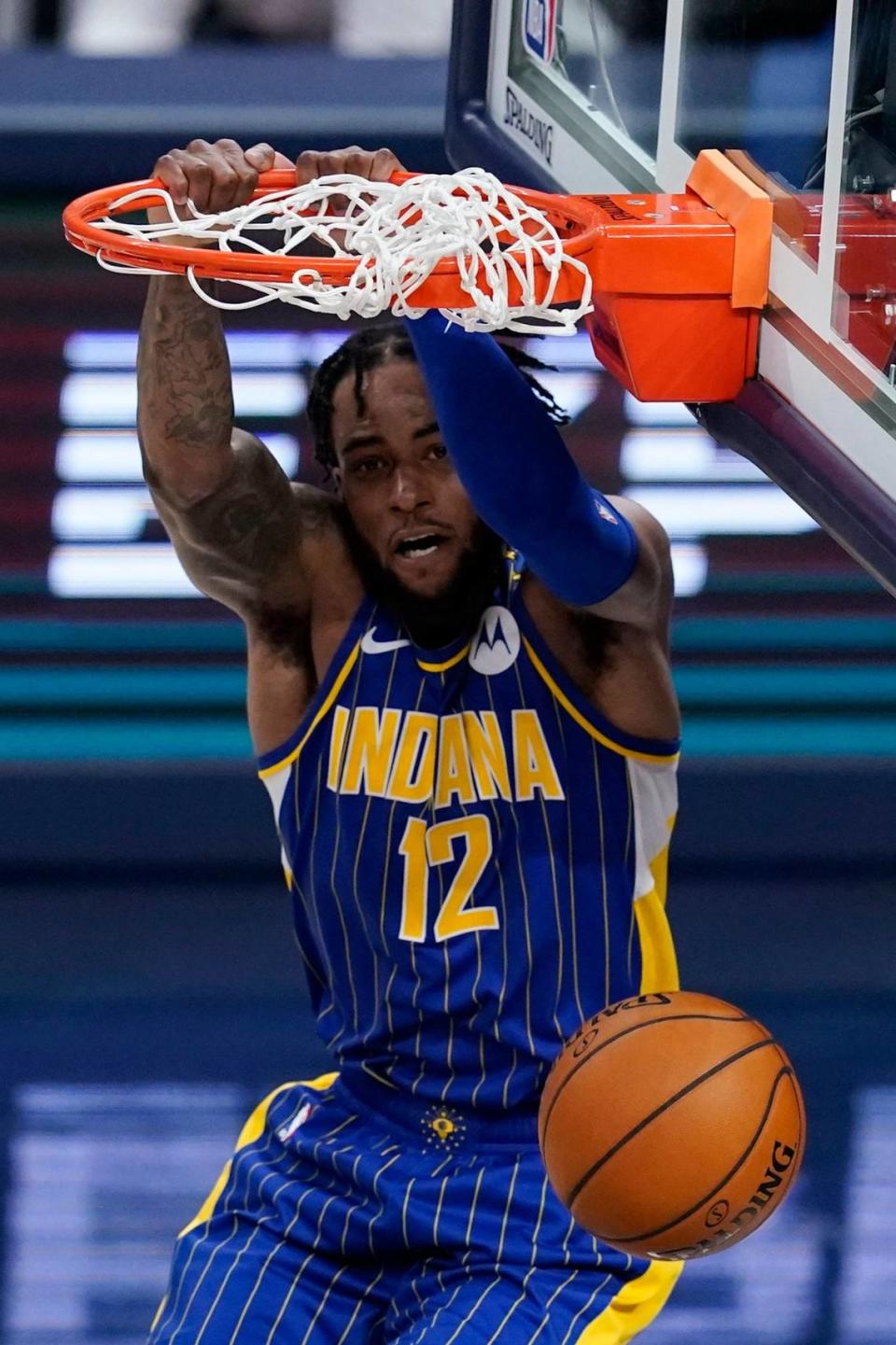 Indiana’s Oshae Brissett dunks during the second half of the team’s NBA basketball Eastern Conference play-in game against the Charlotte Hornets, Tuesday, May 18, 2021, in Indianapolis. Indiana won, 144-117.