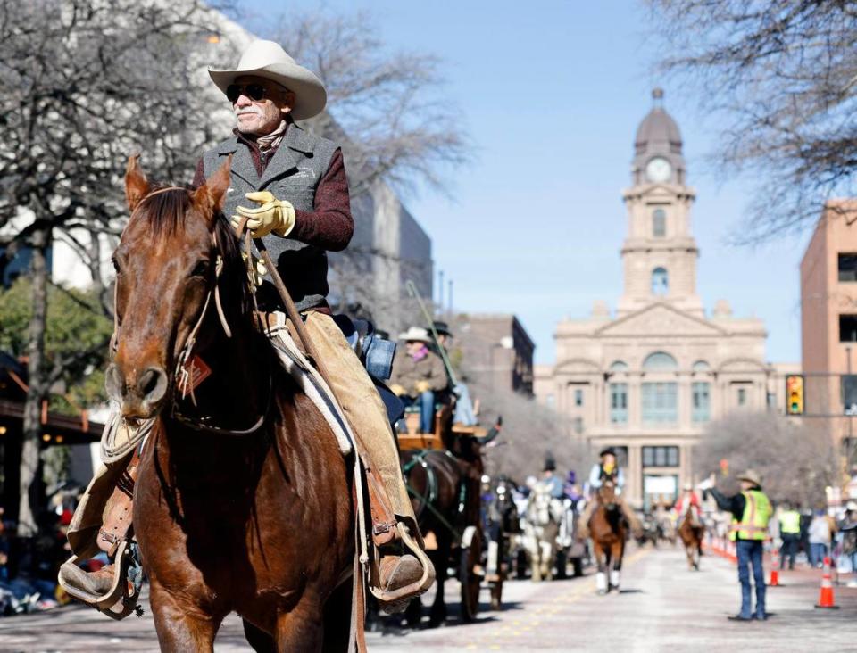 Hundreds of cowboys, horses and wagons filled the parade route during the Fort Worth Stock Show and Rodeo parade in Fort Worth.