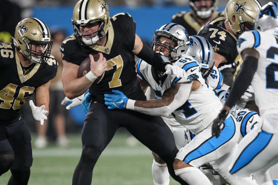 Sep 18, 2023; Charlotte, North Carolina, USA; New Orleans Saints quarterback <a class="link " href="https://sports.yahoo.com/nfl/players/30614" data-i13n="sec:content-canvas;subsec:anchor_text;elm:context_link" data-ylk="slk:Taysom Hill;sec:content-canvas;subsec:anchor_text;elm:context_link;itc:0">Taysom Hill</a> (7) is tackled by <a class="link " href="https://sports.yahoo.com/nfl/teams/carolina/" data-i13n="sec:content-canvas;subsec:anchor_text;elm:context_link" data-ylk="slk:Carolina Panthers;sec:content-canvas;subsec:anchor_text;elm:context_link;itc:0">Carolina Panthers</a> linebacker <a class="link " href="https://sports.yahoo.com/nfl/players/29442" data-i13n="sec:content-canvas;subsec:anchor_text;elm:context_link" data-ylk="slk:Kamu Grugier-Hill;sec:content-canvas;subsec:anchor_text;elm:context_link;itc:0">Kamu Grugier-Hill</a> (54) during the second half at Bank of America Stadium. Mandatory Credit: Jim Dedmon-USA TODAY Sports