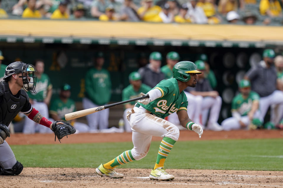 Oakland Athletics second baseman Tony Kemp drops his bat after hitting an RBI-single against the Chicago White Sox during the fifth inning of a baseball game in Oakland, Calif., Sunday, Sept. 11, 2022. (AP Photo/Godofredo A. Vásquez)