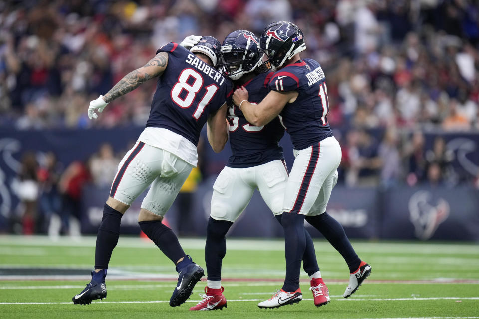 Houston Texans' Dare Ogunbowale, center, reacts with teammates Eric Saubert (81) and Cameron Johnston after kicking a field goal against the Tampa Bay Buccaneers during the second half of an NFL football game, Sunday, Nov. 5, 2023, in Houston. (AP Photo/Eric Christian Smith)