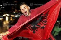 An Albanian soccer fan celebrates after Albania beat Armenia in their Euro 2016 Group I qualifying soccer match, in Tirana, Albania October 11, 2015. REUTERS/Arben Celi