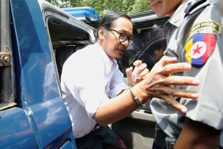 Filmmaker Min Htin Ko Ko Gyi arrives at Insein court before his trial in Yangon