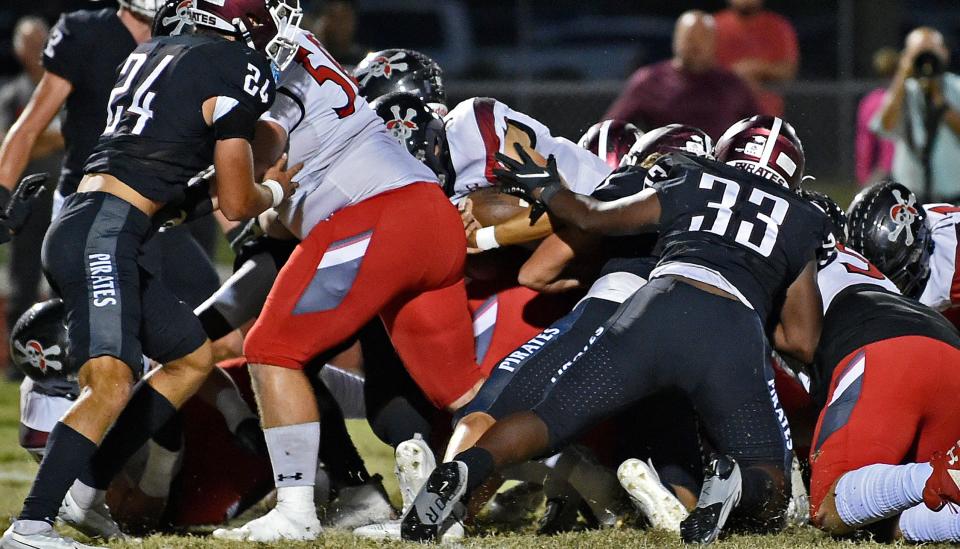 Port Charlotte Pirates' quarterback Bryce Eaton on a quarterback keeper scoring a touchdown over the Braden River Pirates at the Pirates Stadium, Friday evening, Nov. 4, 2022, in east Bradenton.