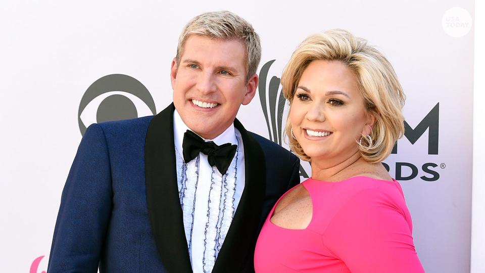 Todd Chrisley, left, and his wife, Julie Chrisley, pose for photos at the 52nd annual Academy of Country Music Awards on April 2, 2017, in Las Vegas. The couple, stars of the reality television show “Chrisley Knows Best,” have been found guilty in Atlanta on federal charges including bank fraud and tax evasion Tuesday, June 7, 2022.