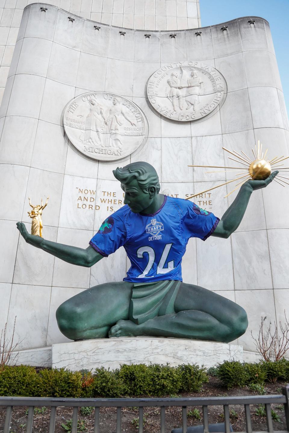 A 2024 NFL draft jersey on the Spirit of Detroit statue in downtown Detroit on Thursday, March 28, 2024.