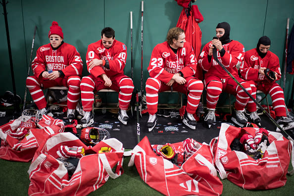 BOSTON, MA - JANUARY 08: Boston University Terriers Tommy Kelly #22, Gabriel Chabot #10, Jakob Forsbacka Karlsson #23, Bobo Carpenter #14 and Patrick Harper #21 prepare before taking the ice against the University of Massachusetts Minuteman at Fenway Park on January 8, 2017 in Boston, Massachusetts. (Photo by Michael Ivins/Boston Red Sox/Getty Images)