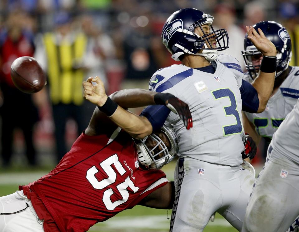 Arizona’s Chandler Jones strips the ball from Seattle’s Russell Wilson. (AP)