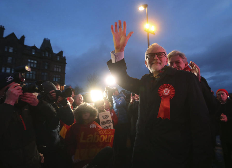 Britain's Main opposition Labour Party leader Jeremy Corbyn, waves to supporters on the last day of campaigning ahead of the General Election, in Glasgow, Scotland, Wednesday Dec. 11, 2019. Britain goes to the polls in a General Election on Dec. 12. (Andrew Milligan/PA via AP)