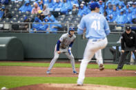 Texas Rangers outfielder Evan Carter leads off of first base during the fifth inning of a baseball game against the Kansas City Royals, Sunday, May 5, 2024, in Kansas City, Mo. (AP Photo/Nick Tre. Smith)
