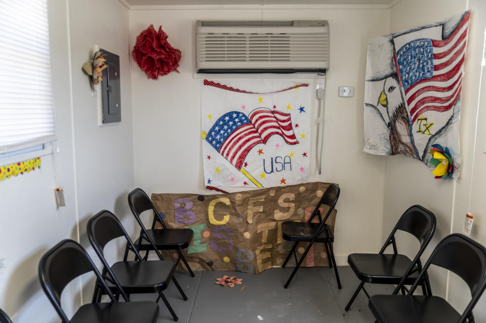 Artwork made by previous residents hangs inside a welcome center at a Influx Care Facility (ICF) for unaccompanied children on Sunday, February 21, 2021, in Carrizo Springs, Texas. / Credit: Sergio Flores/The Washington Post via Getty Images  