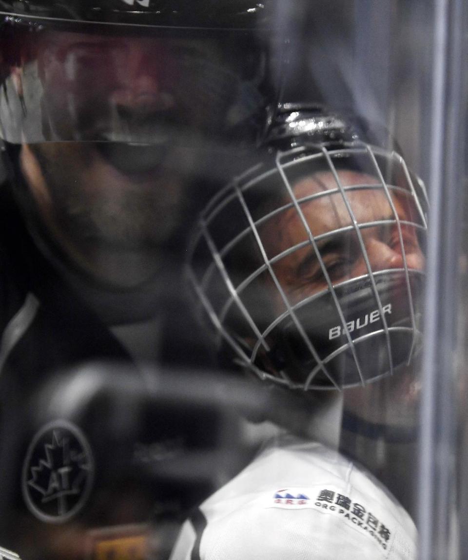 Singer Justin Bieber, who is playing for Team Gretzky, is pushed into the glass by Chris Pronger of Team Lemieux during the first period of the NHL All-Star Celebrity Shootout at Staples Center, Saturday, Jan. 28, 2017, in Los Angeles. The NHL All-Star Game is scheduled to be played at Staples Center on Sunday. (AP Photo/Mark J. Terrill)