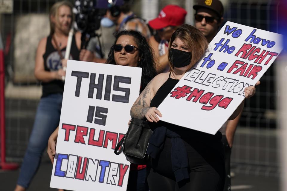 FILE - In this Saturday, Nov. 7, 2020 file photo, Supporters of President Donald Trump rally outside the Maricopa County Recorder's Office in Phoenix. Election officials and experts are raising alarms about the private fundraising surrounding efforts to expand Republican ballot reviews to more states former President Donald Trump falsely claims he won. While some fundraising details have come to light, information about who is donating the money and how it's being spent is largely exempt from public disclosure. (AP Photo/Ross D. Franklin, File)