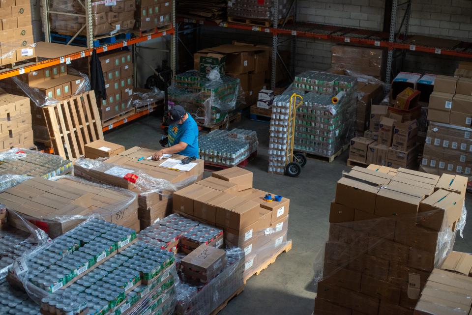 Samuel Ramirez looks over paperwork at the headquarters of the Westside Food Bank in Santa Monica, Calif.