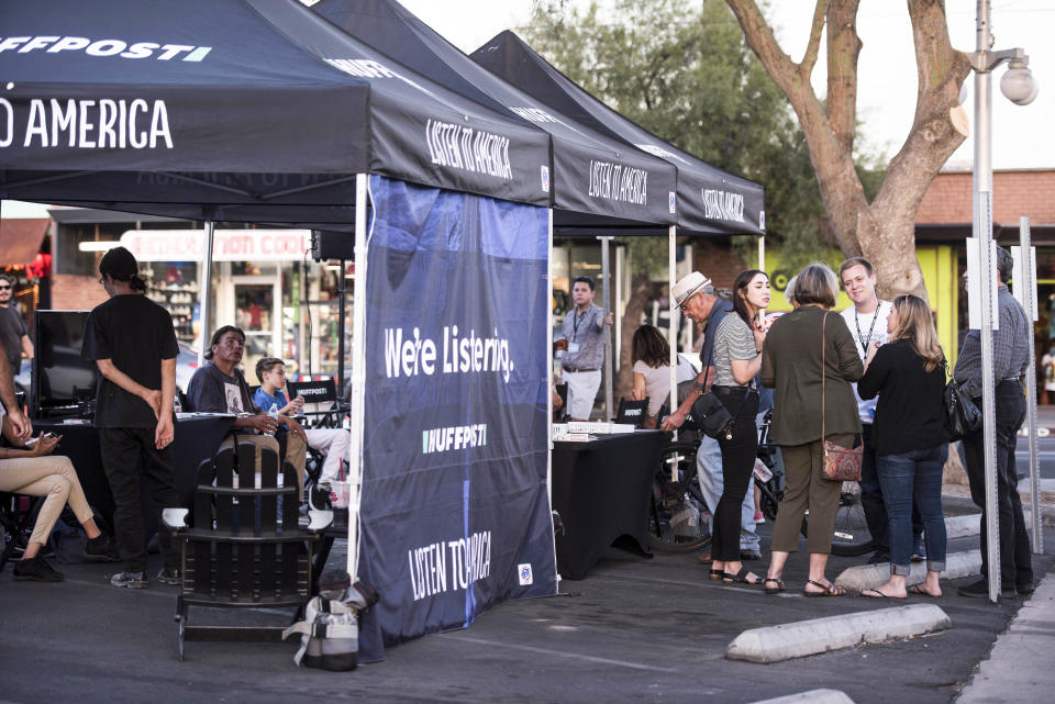 People visit the "Listen to America" tents in Tucson, Arizona.