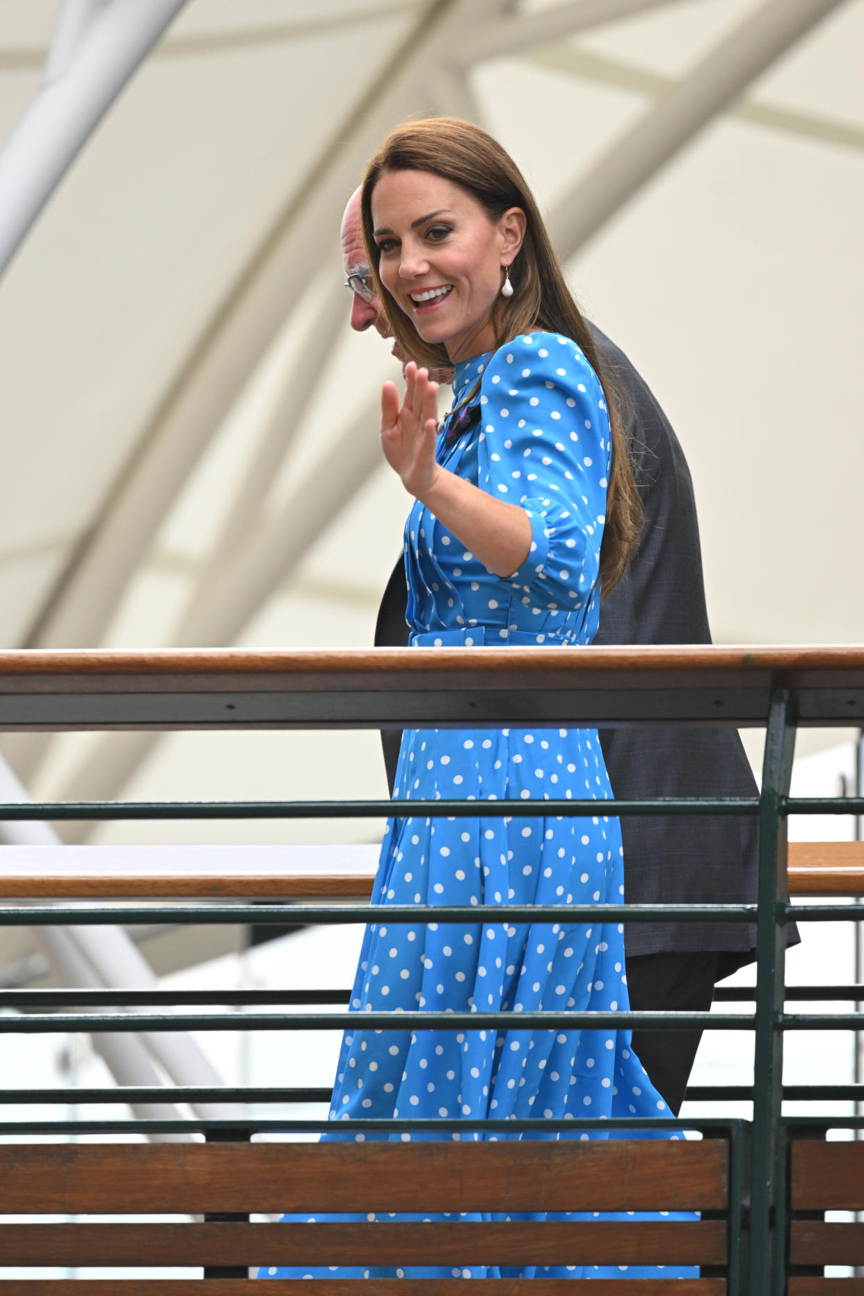 The Duchess of Cambridge waved at fans as she crossed the bridge from the millennium building into Centre Court after arriving through the players' entrance. (Getty Images)