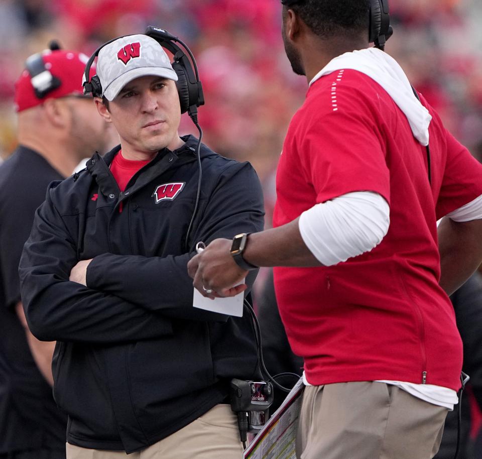 Wisconsin head coach Jim Leonhard, left, is shown during the first quarter of their game against Minnesota Saturday, November 26, 2022 at Camp Randall Stadium in Madison, Wis.<br>Uwgrid26 6