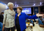 International Monetary Fund (IMF) Managing Director Kristalina Georgieva, right, speaks with former International Monetary Fund (IMF) Managing Director Christine Lagarde during the plenary of the International Monetary and Financial Committee (IMFC) meeting, at the World Bank/IMF Annual Meetings in Washington, Saturday, Oct. 19, 2019. (AP Photo/Jose Luis Magana)