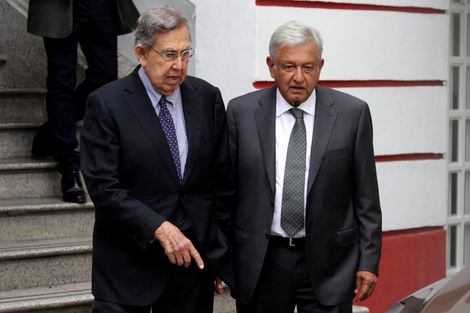 Mexico's president-elect Andres Manuel Lopez Obrador (R) talks with Mexican politician Cuauhtemoc Cardenas while leaving his campaign headquarters in Mexico City, Mexico July 3, 2018. REUTERS/Daniel Becerril