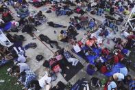 A caravan of migrants, mostly from Central America, heading north, stop to rest in the Alvaro Obregon community, Tapachula municipality, Chiapas state, Mexico, Saturday, Oct. 23, 2021. (AP Photo/Marco Ugarte)