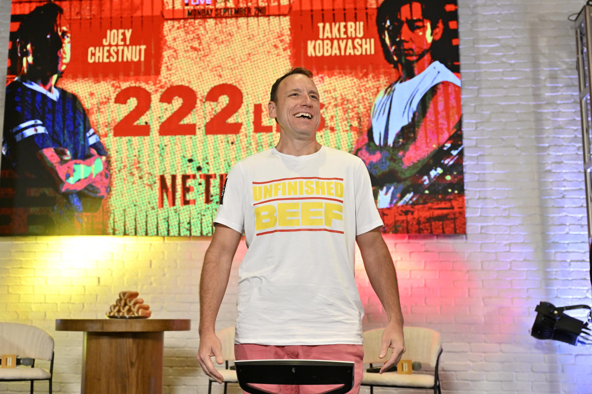 Joey Chestnut beats Takeru Kobayashi with a new world record of 83 hot dogs and wins Netflix eating contest