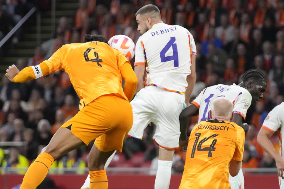 Netherlands' Virgil van Dijk, left, scores his sides first goal during the UEFA Nations League soccer match between the Netherlands and Belgium at the Johan Cruyff ArenA in Amsterdam, Netherlands, Sunday, Sept. 25, 2022. (AP Photo/Peter Dejong)