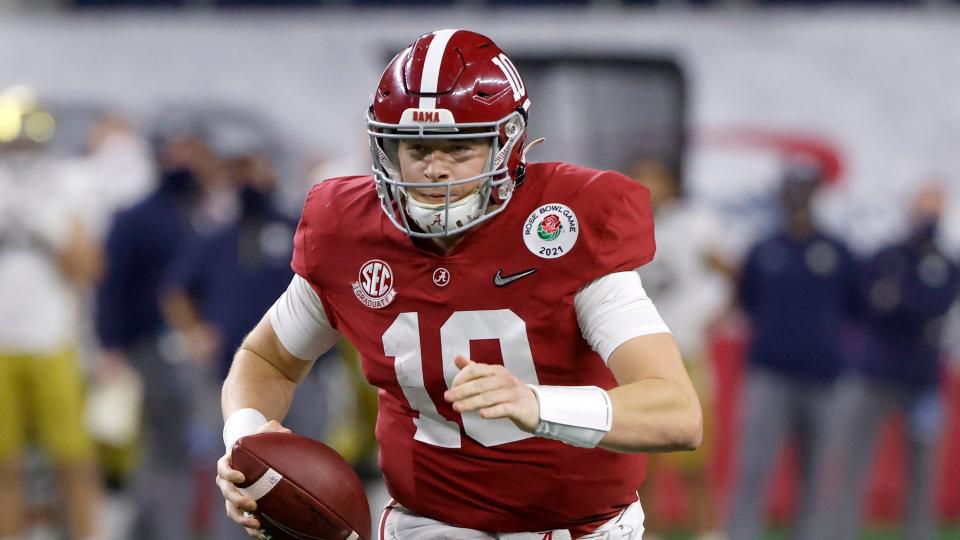 Alabama quarterback Mac Jones (10) carries the ball against Notre Dame during the Rose Bowl NCAA college football game in Arlington, Texas, Friday, Jan. 1, 2021. (AP Photo/Ron Jenkins)