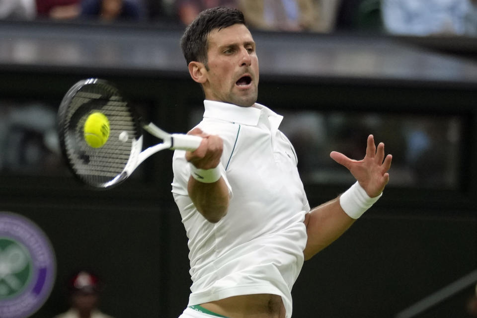 FILE - Serbia's Novak Djokovic returns to Korea's Kwon Soonwoo in a men's first round singles match on day one of the Wimbledon tennis championships in London, Monday, June 27, 2022. Djokovic's bid for Wimbledon title No. 8 and Grand Slam trophy No. 24 starts next week. (AP Photo/Kirsty Wigglesworth, File)