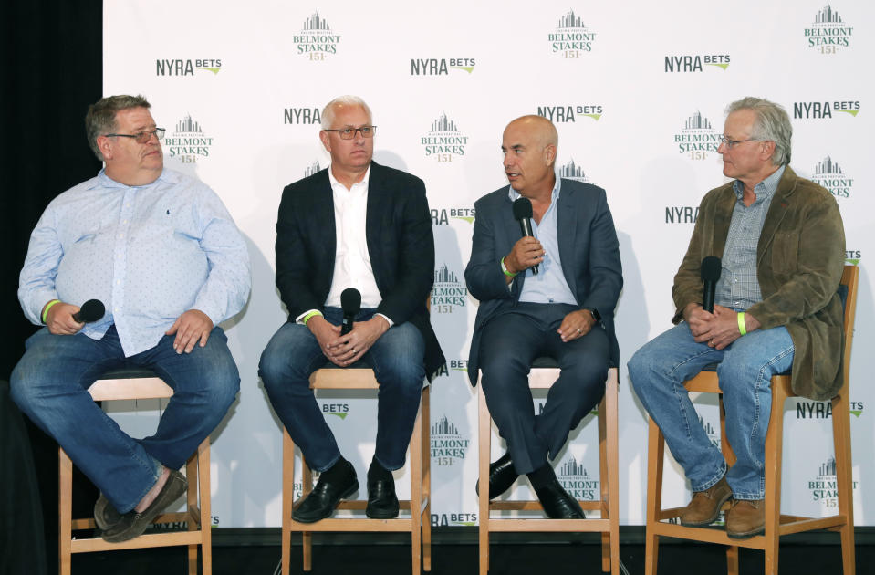 From left, Everfast trainer Dale Romans, Intrepid Heart and Spinoff trainer Todd Pletcher, War of Will trainer Mark Casse and Tacitis trainer Bill Mott answer questions during a draw ceremony for the 2019 Belmont Stakes race, Tuesday, June 4, 2019, in New York. (AP Photo/Kathy Willens)