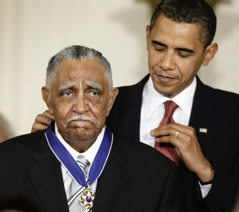 FILE - In this Aug. 12, 2009, file photo, President Barack Obama presents a 2009 Presidential Medal of Freedom to the Rev. Joseph E. Lowery n the East Room of the the White House in Washington. Lowery, a veteran civil rights leader who helped the Rev. Dr. Martin Luther King Jr. found the Southern Christian Leadership Conference and fought against racial discrimination, died Friday, March 27, 2020, a family statement said. He was 98. (AP Photo/J. Scott Applewhite, File)