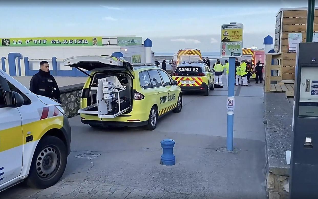 Emergency services are pictured this morning at Wimereux, near Calais