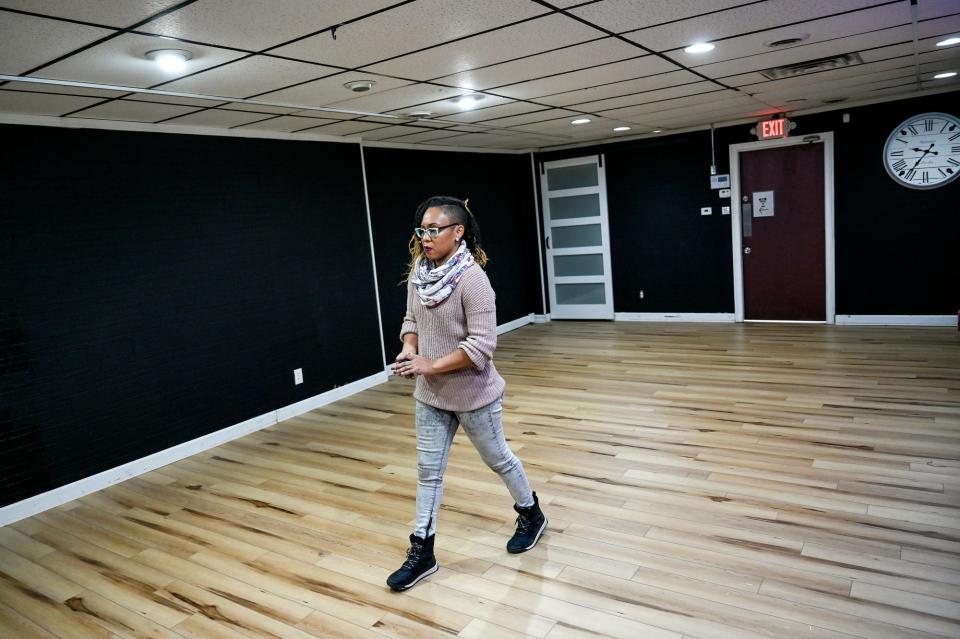 Tiffany Nordé walks through the new Rock the Block Studio on Thursday, Dec. 2, 2021, in Lansing's REO Town.