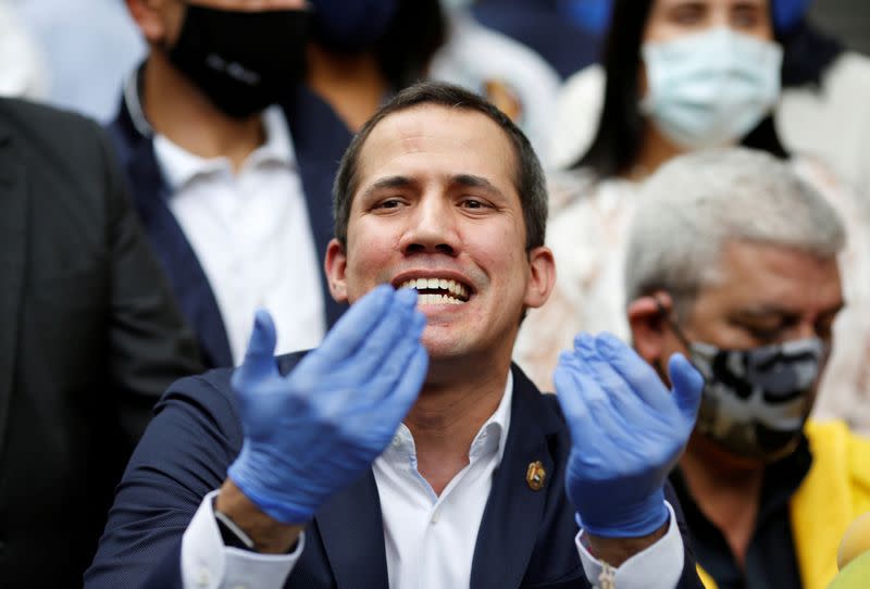 FILE PHOTO: Venezuelan opposition leader Juan Guaido speaks during a news conference after Venezuela's pro-government supreme court replaced the leaders of two key opposition parties, months ahead of legislative elections in Caracas