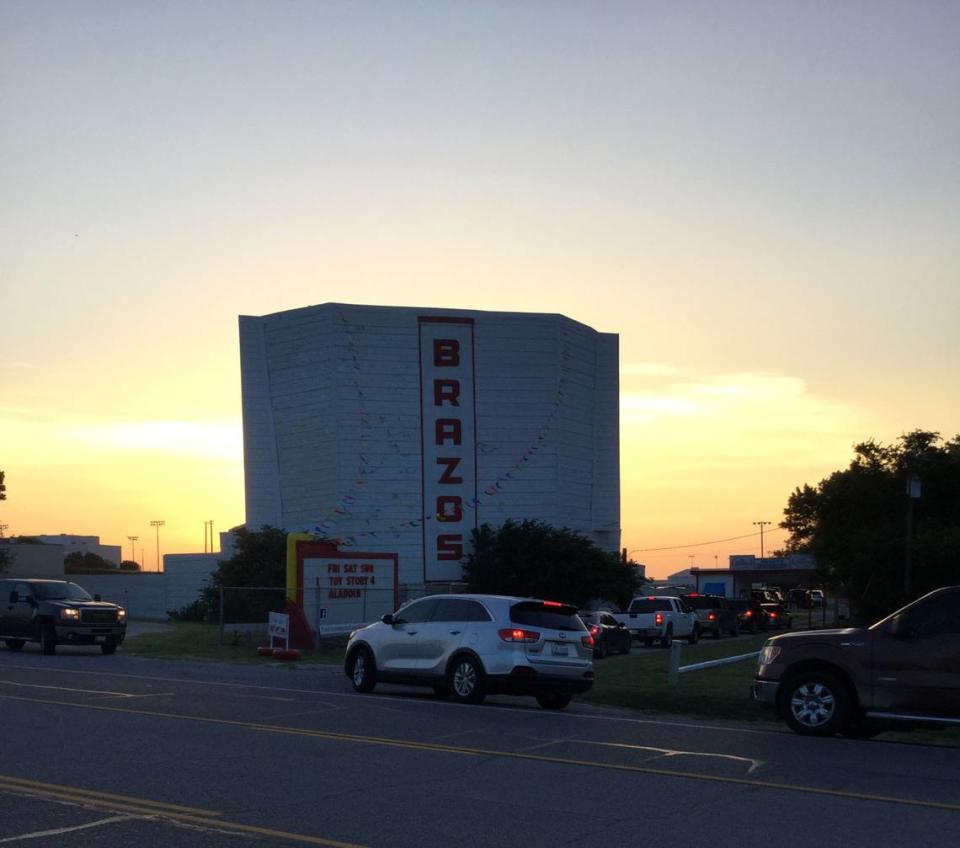 Brazos drive in movie theater opening up their gates at dusk to welcome movie watchers.