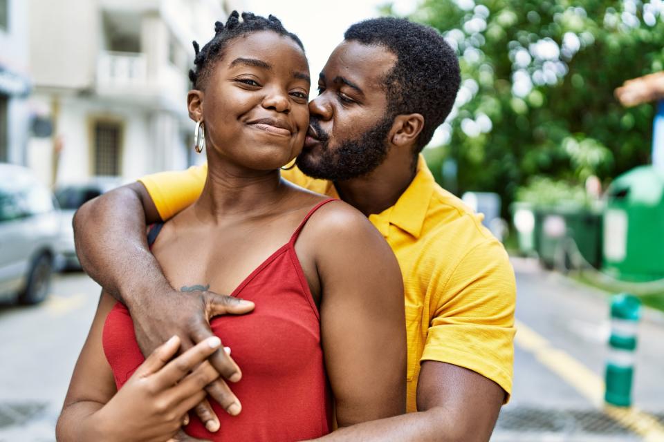 A man and a woman embracing outdoors