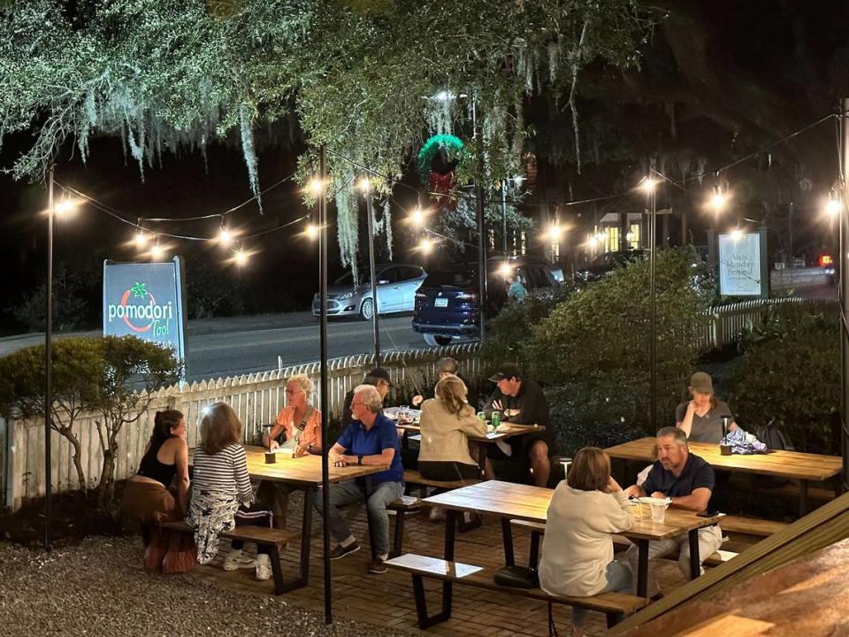 Guest at Pomodori Too! Italian Take-out, in Bluffton, sit under a 600 year-old-live oak to enjoy their dinners.