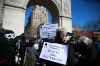 <p>People wears signs and attend the “A Mock Funeral for President’s Day” rally at Washington Square Park in New York City on Feb. 18, 2017. (Gordon Donovan/Yahoo News) </p>